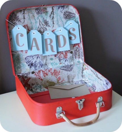 I adore a vintage suitcase used for wedding cards but this modern and 