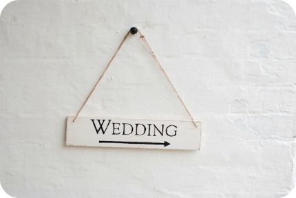 Point the way to your wedding with a rustic sign you can make yourself